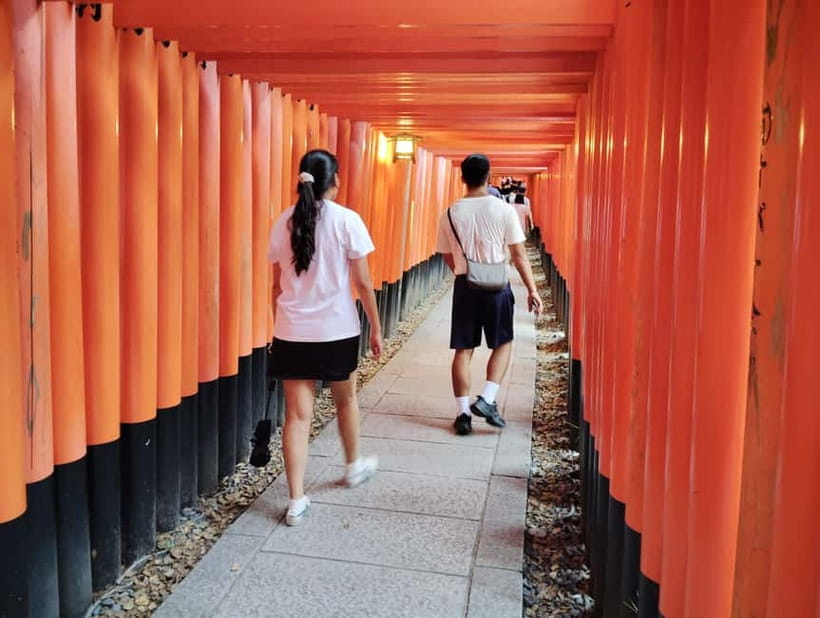 Kyoto: 1.5-Hour Guided Tour of Fushimi Inari Shrine - First stop: Inari Station and a bright yellow sign